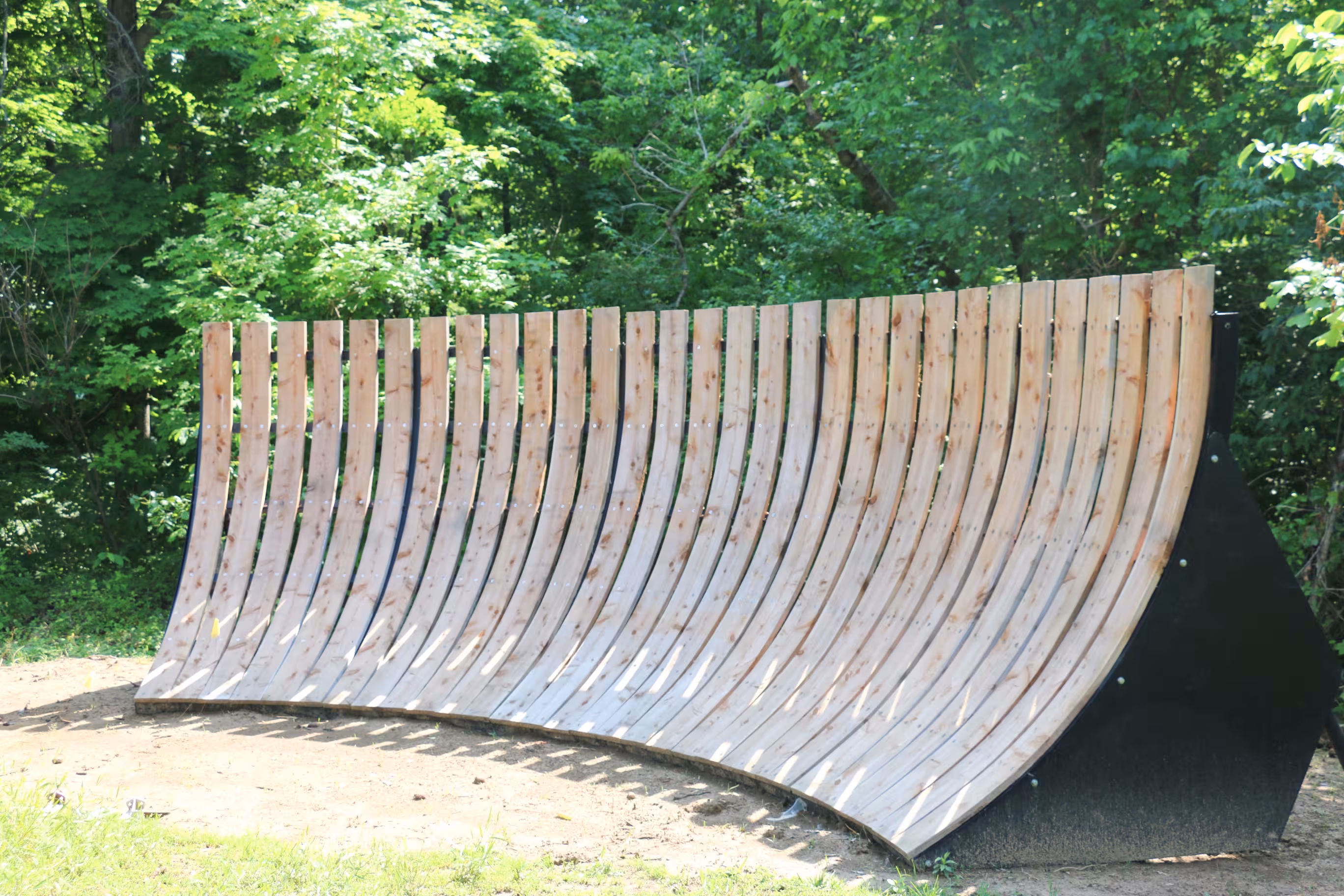 a wooden ramp in a park