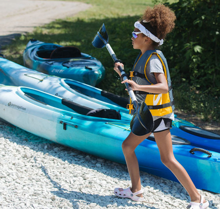 a girl holding a paddle