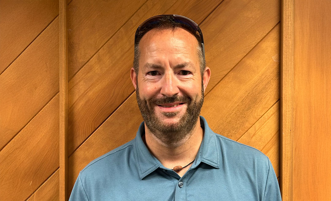 a man smiling for a picture