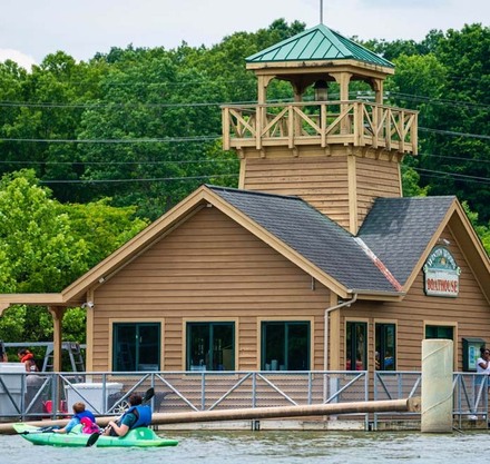 a building with a boat and a bell tower