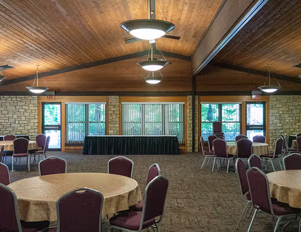 a room with round tables and chairs