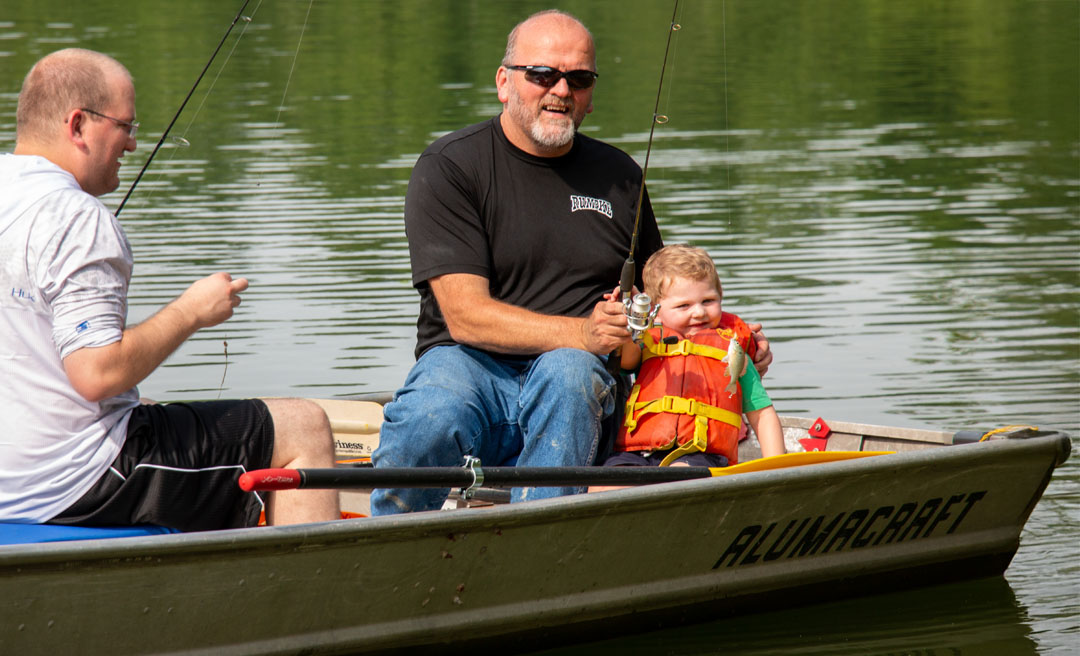 a man and child in a boat
