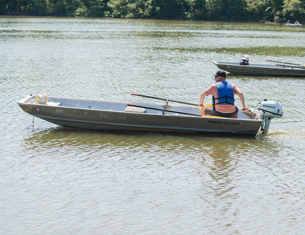 a group of people in a boat on a lake