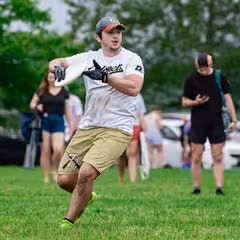 a man holding a frisbee
