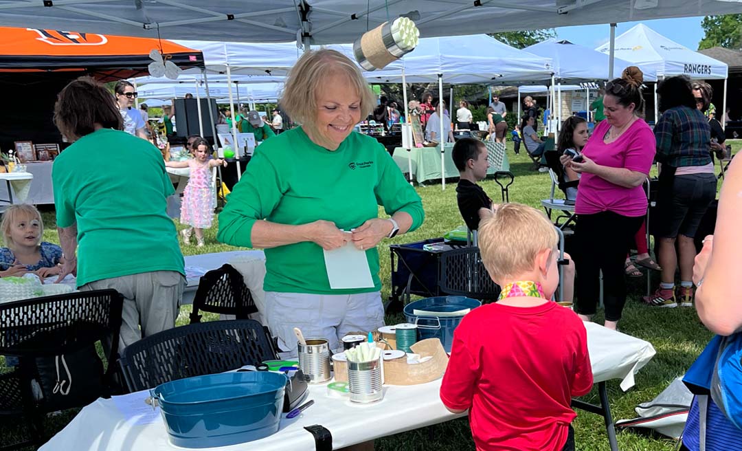 a group of people at a table with food items