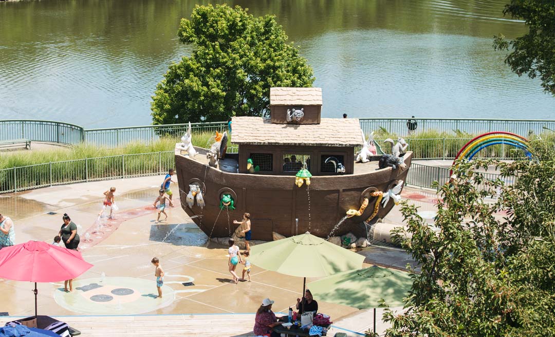 a group of people playing in a water park