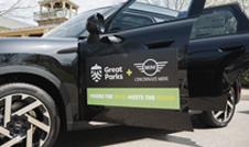 a black car with a sign on the side