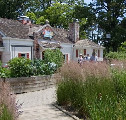 a group of people walking in front of a building