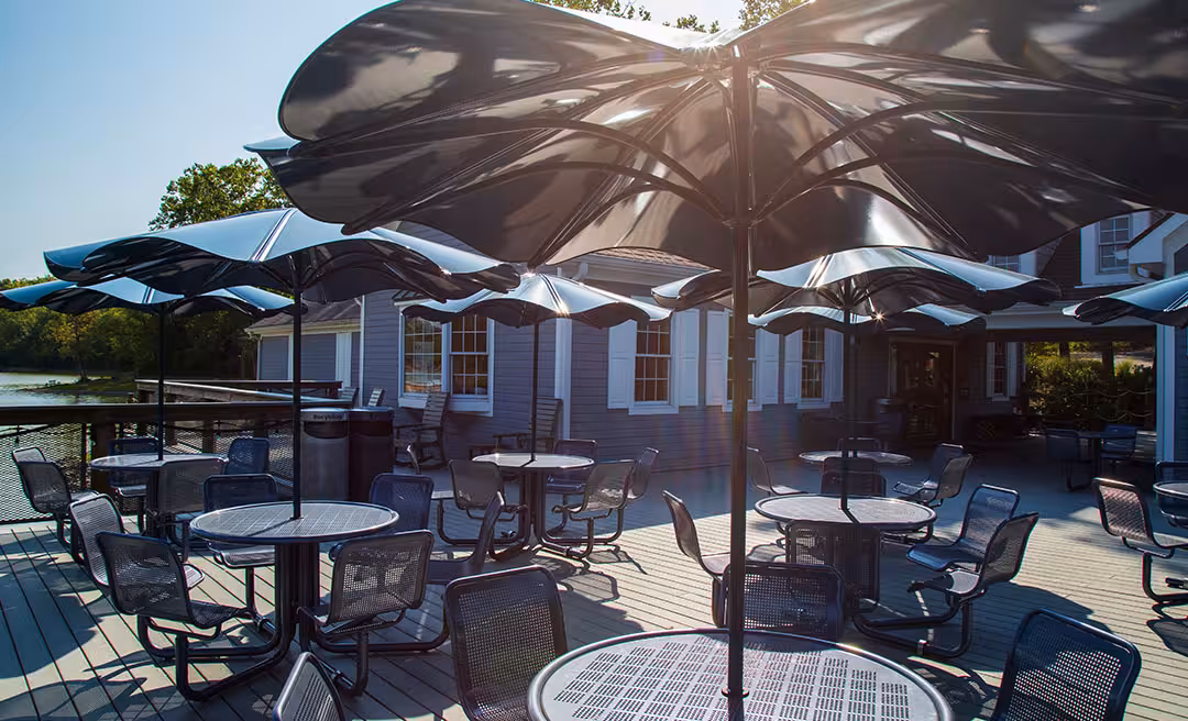 a group of tables and chairs on a patio