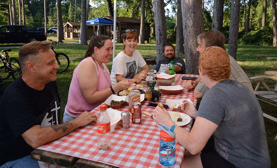 a group of people sitting at a table