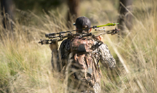 a man carrying a gun