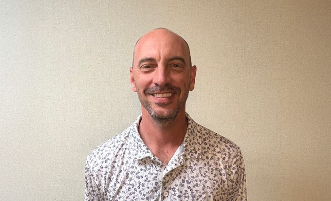 a man smiling at camera