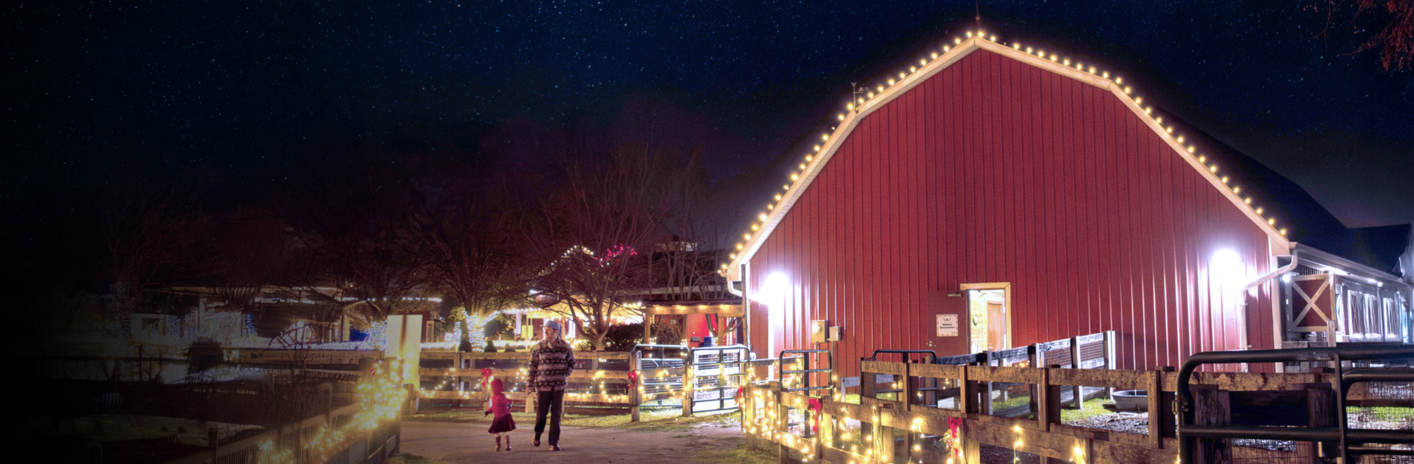 Image of holidays on the farm at night with the event logo superimposed on a barn