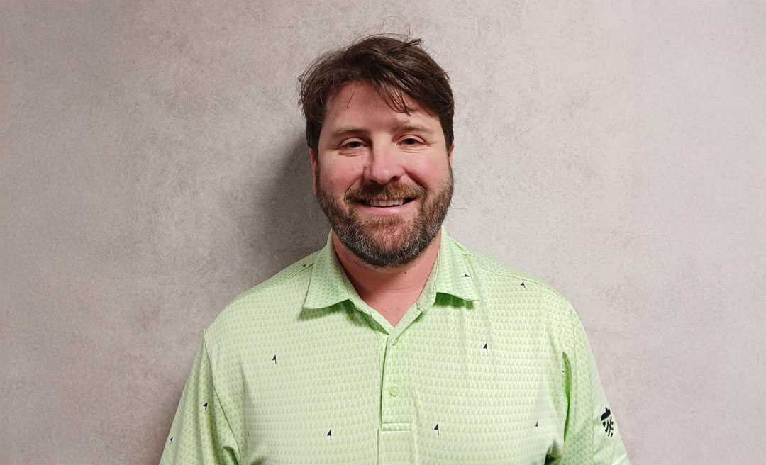 a man in a green shirt